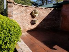 brick courtyard with custom fountain and stamped patio