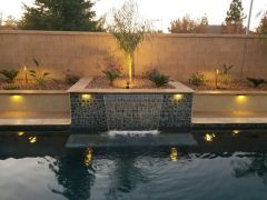 natomas pool with tile waterfall with night lighting
