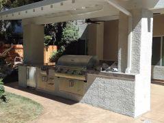 stucco columns and solid roof with fans