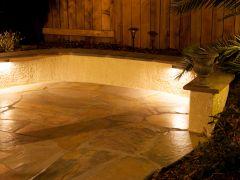 flagstone patio with stucco retaining wall